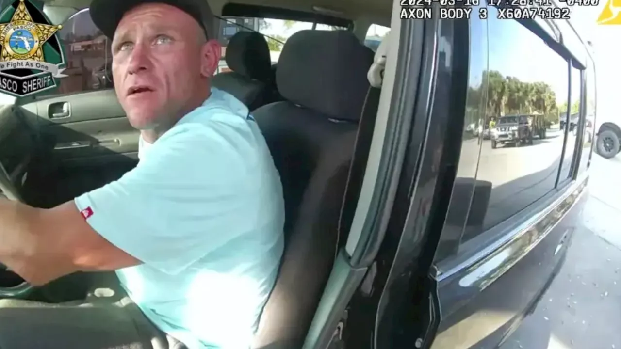 Bodycam captures deputy shooting suspect dead while dangling from his SUV