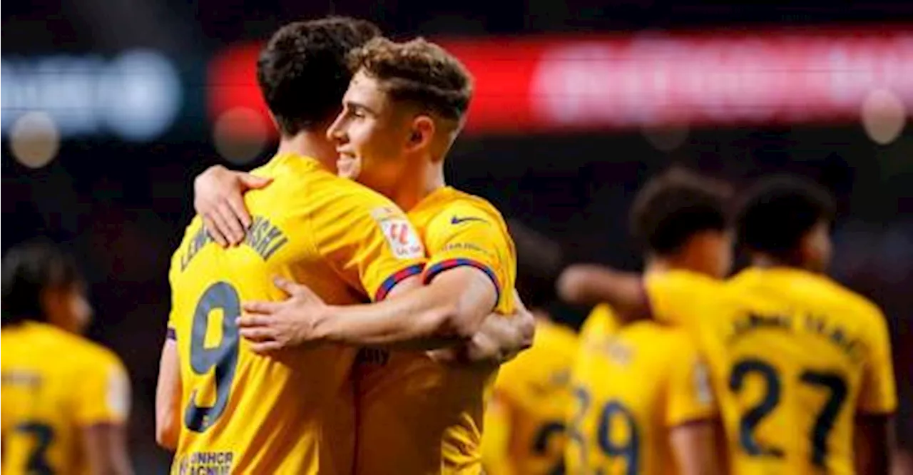 Lewandowski-powered Barca thrash Atletico to stay in title race