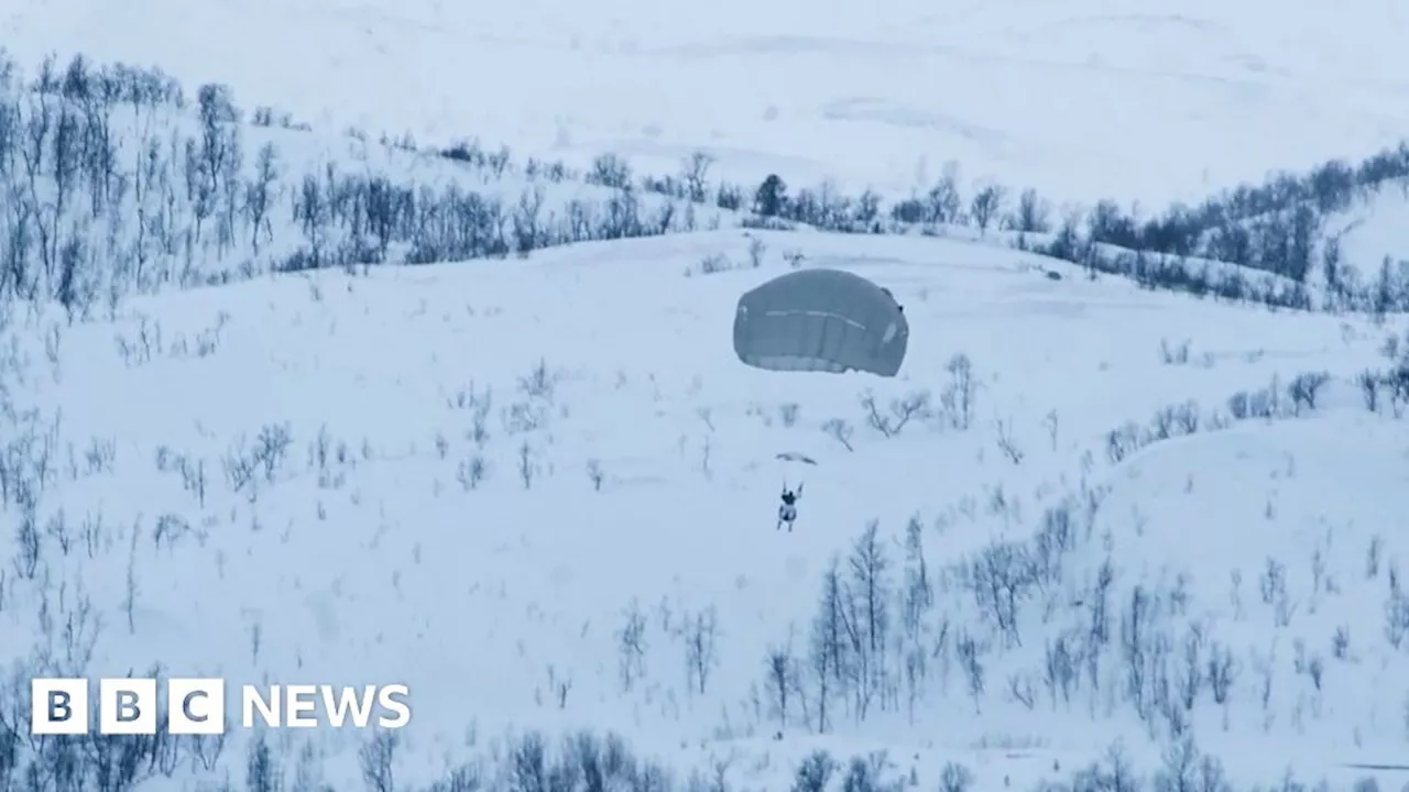 US soldiers parachute onto polar landscape in Norway