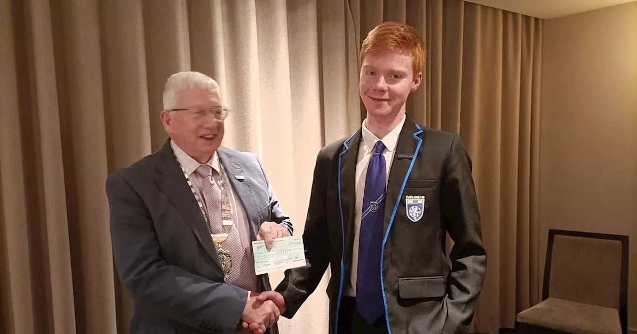 Rotary members entertained by talented young musician from Carluke High School