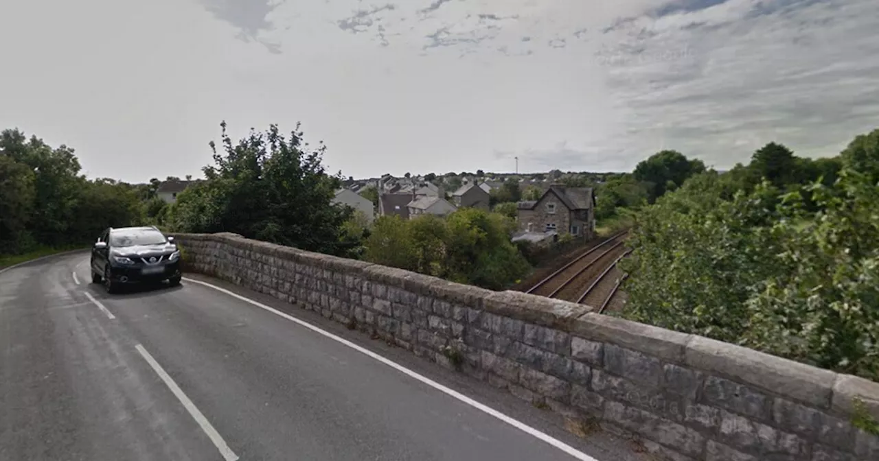 Woman, 33, arrested after man falls from bridge onto railway tracks