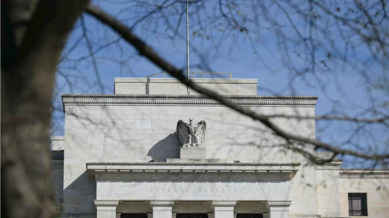 Federal Reserve holds interest rates steady, still projects cuts ahead