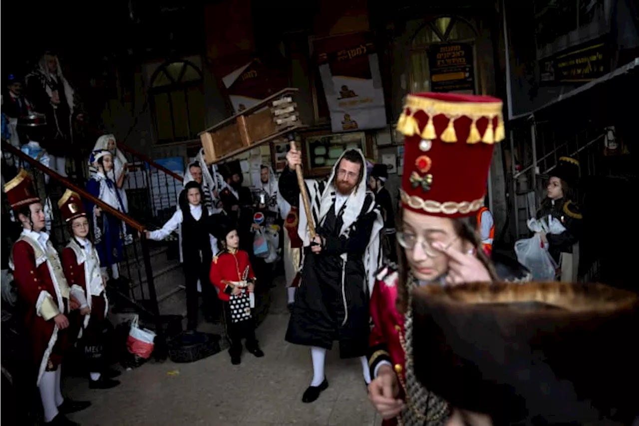 During the Israel-Hamas war, Jews will soon celebrate Purim — one of their most joyous holidays