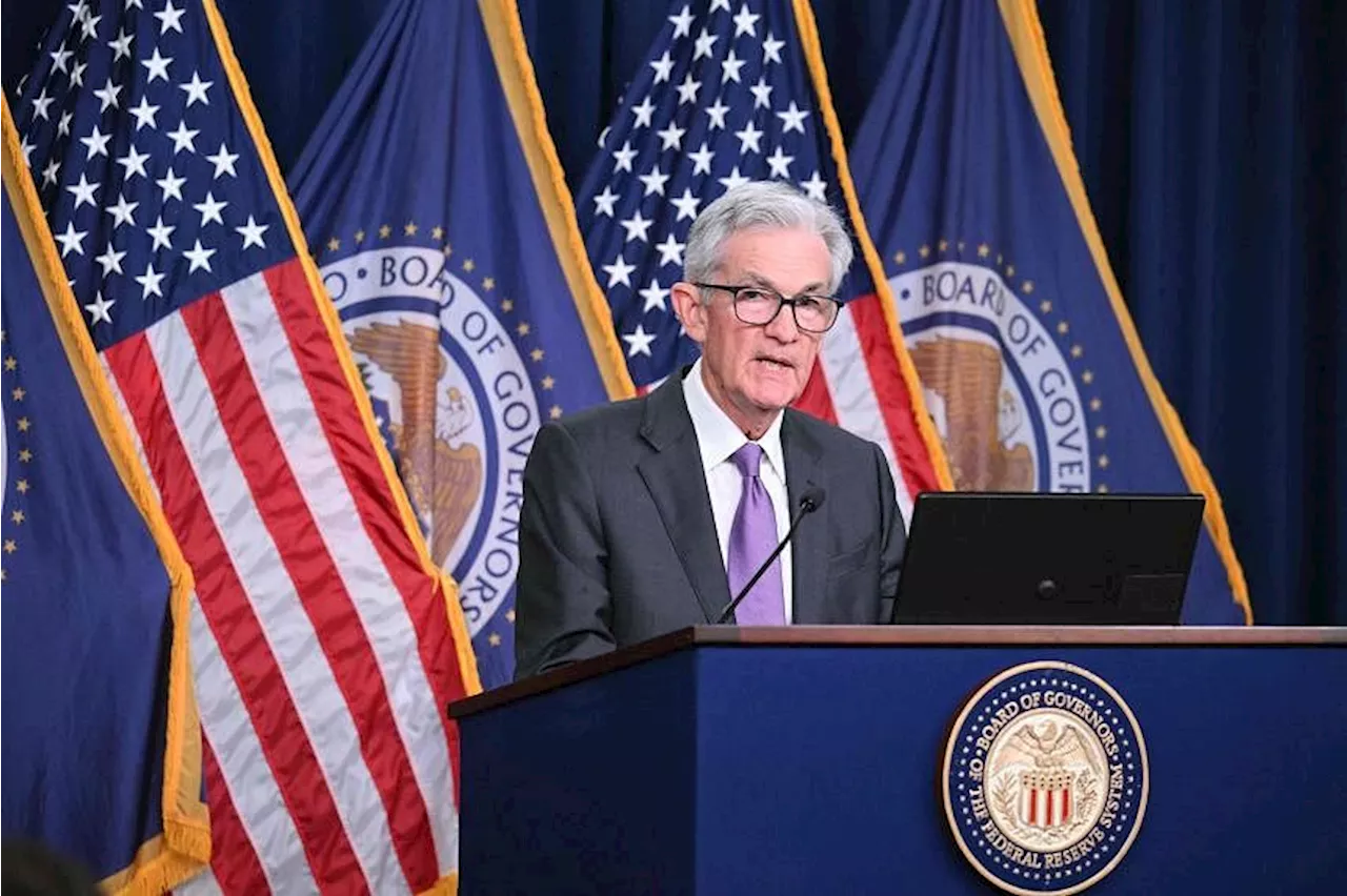 US Fed holds key rate steady, pencils in three cuts in 2024