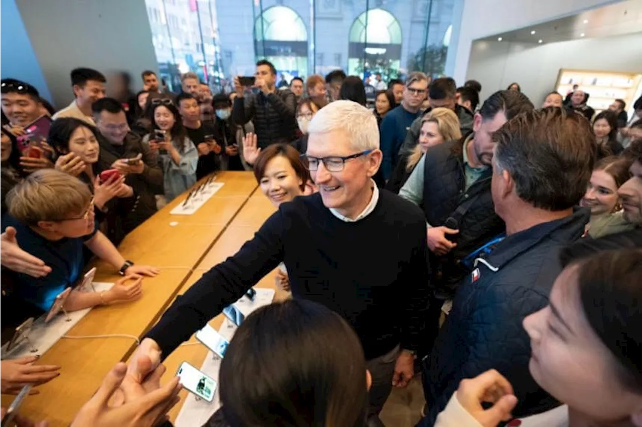 Apple CEO arrives in China touting its role as iPhone base