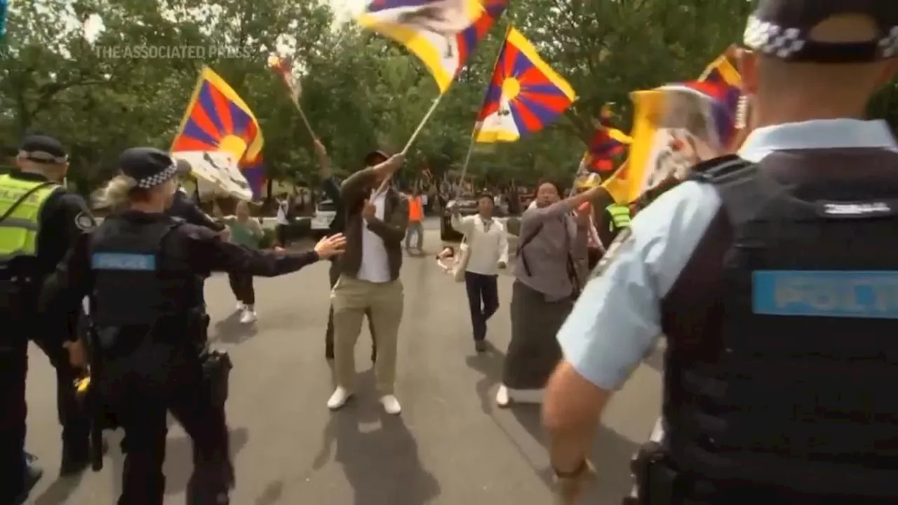 Anti-China protesters clash with police outside Chinese embassy during FM Wang's visit to Canberra