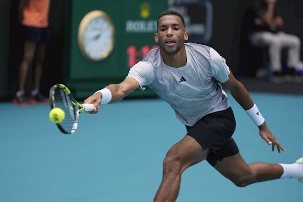 Canadian Auger-Aliassime advances to second round of men's singles at Miami Open.