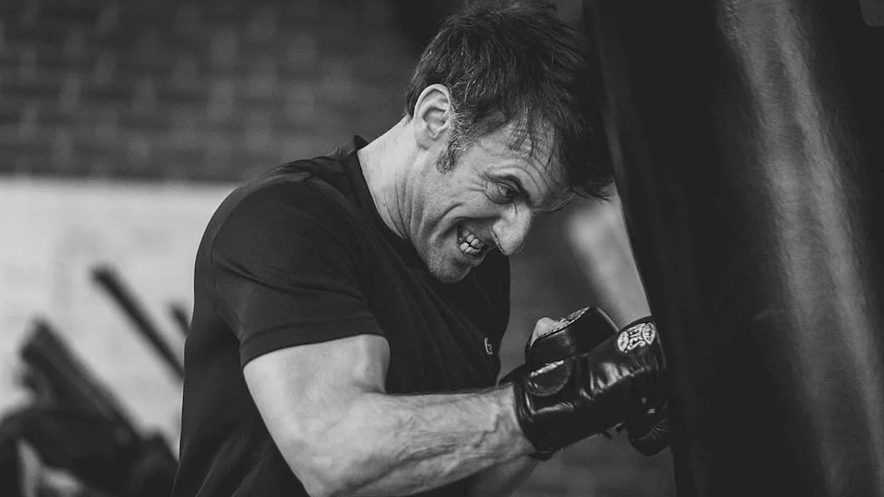 Macho Macron: Buff French president poses for cringe-worthy black and white boxing photos as he...