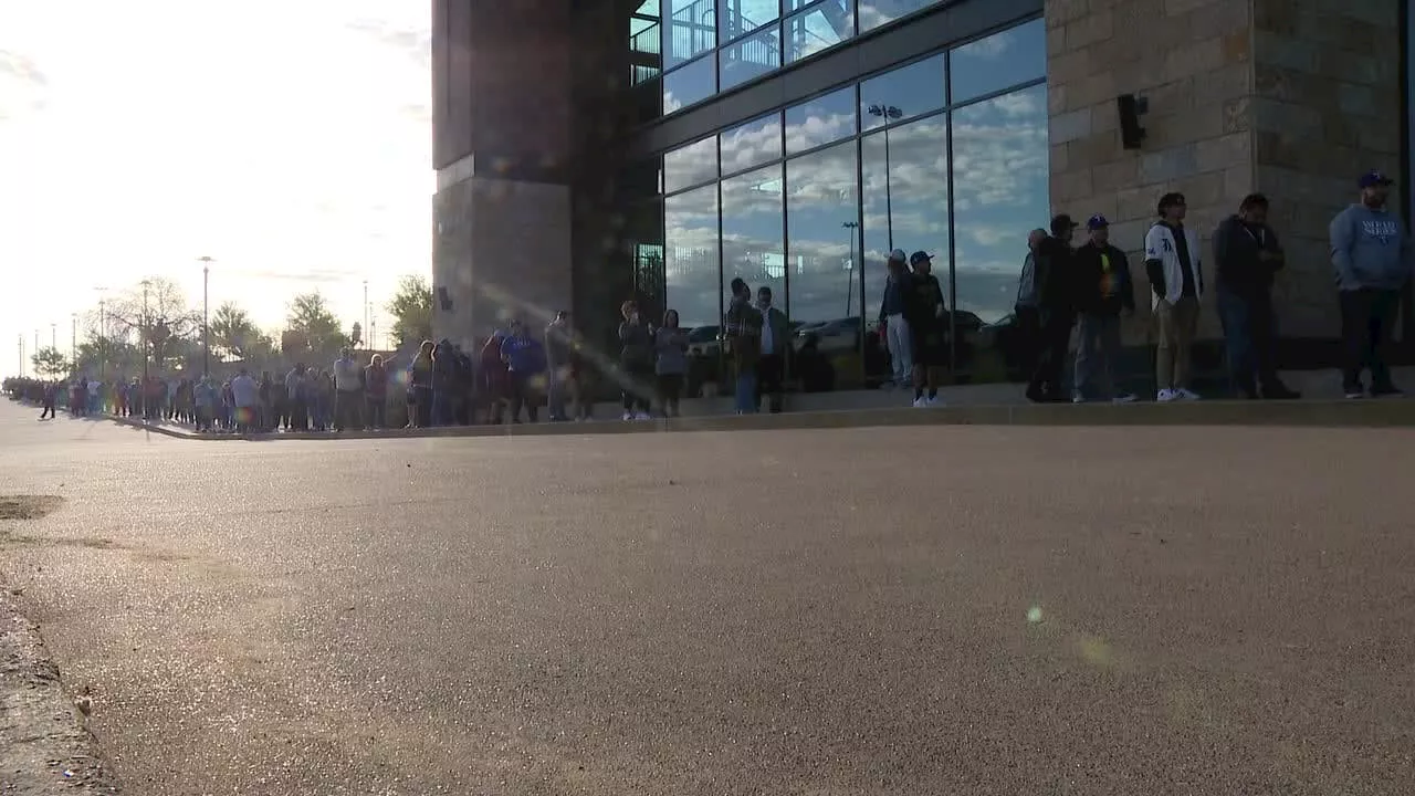 Texas Rangers fans line up outside Globe Life Field overnight for gold championship gear