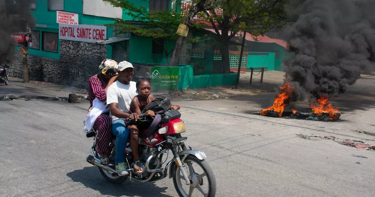 Haiti suspected gang members set on fire as conflict spreads to capital suburb