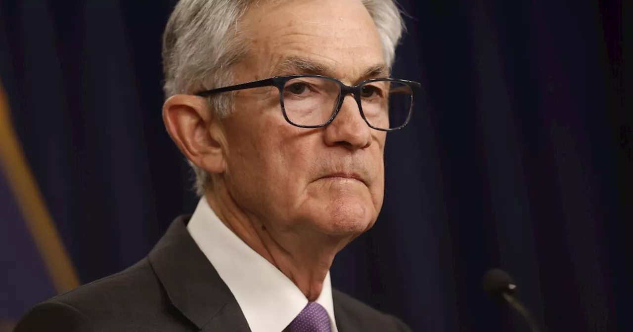 Federal Reserve holds interest rates steady, projects three rate cuts later this year