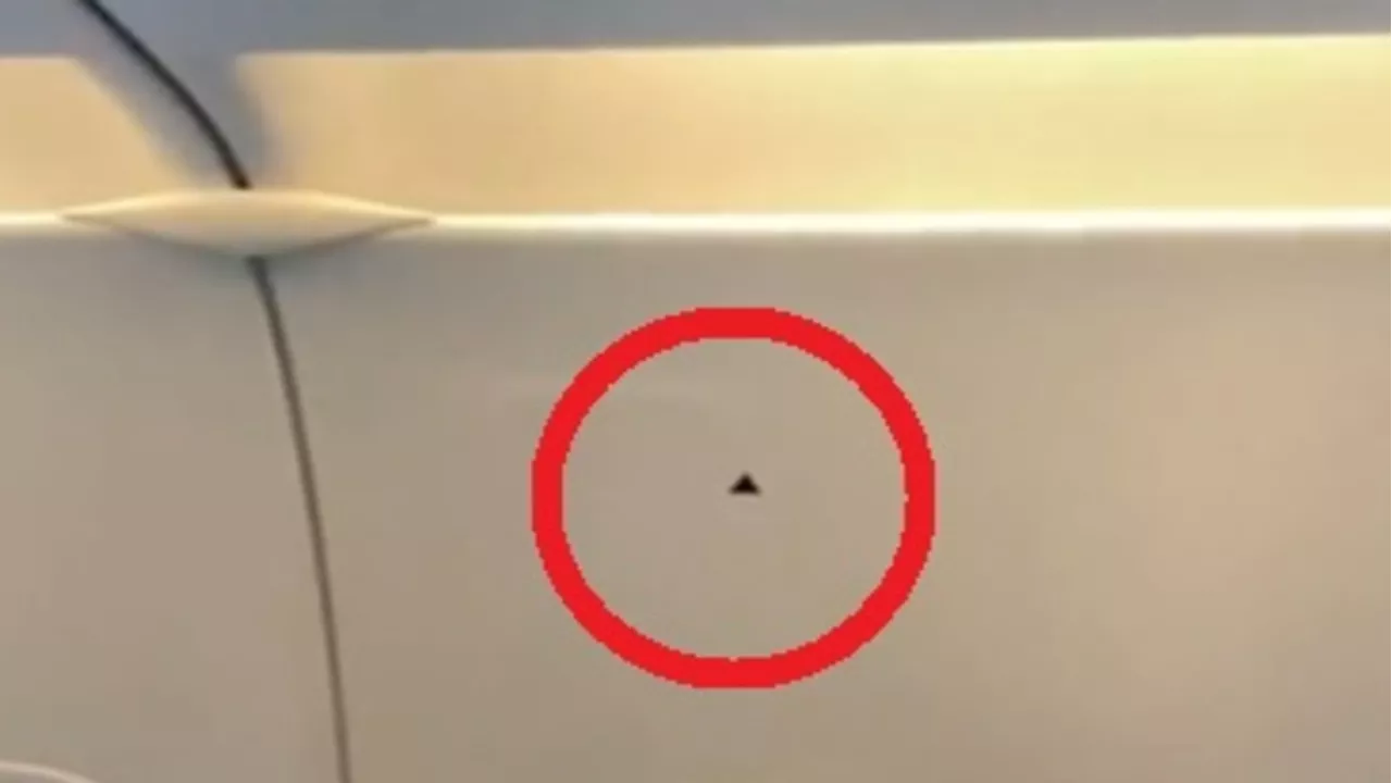 Truth on tiny detail above plane window