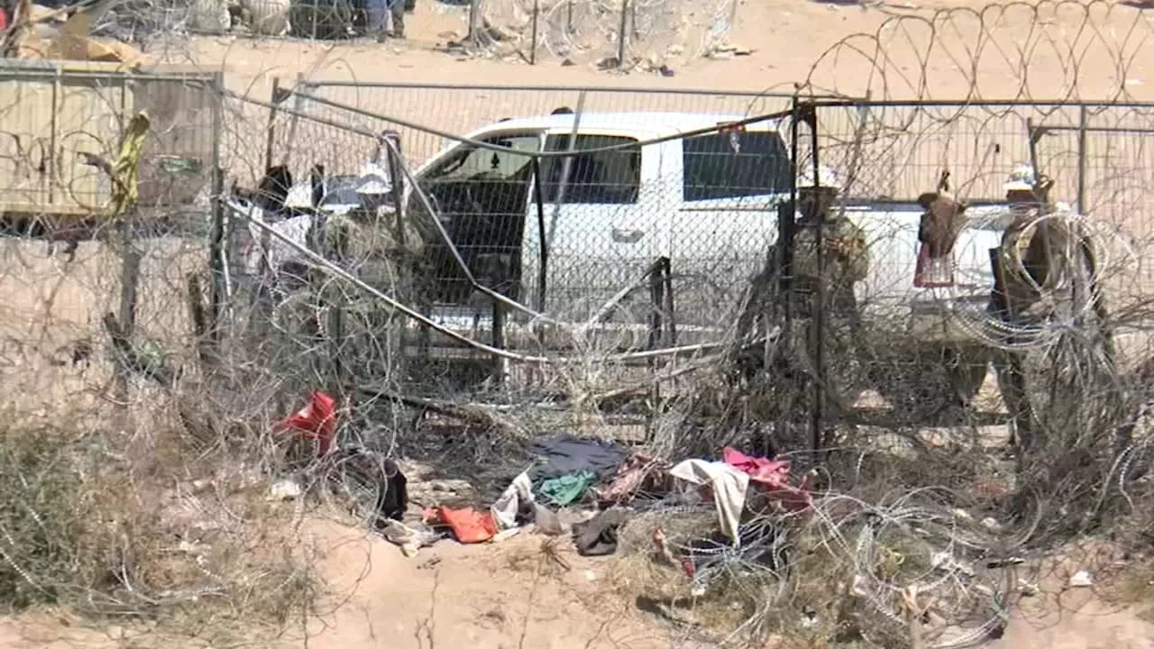 Hundreds of migrants rush past barbed wire at Texas border