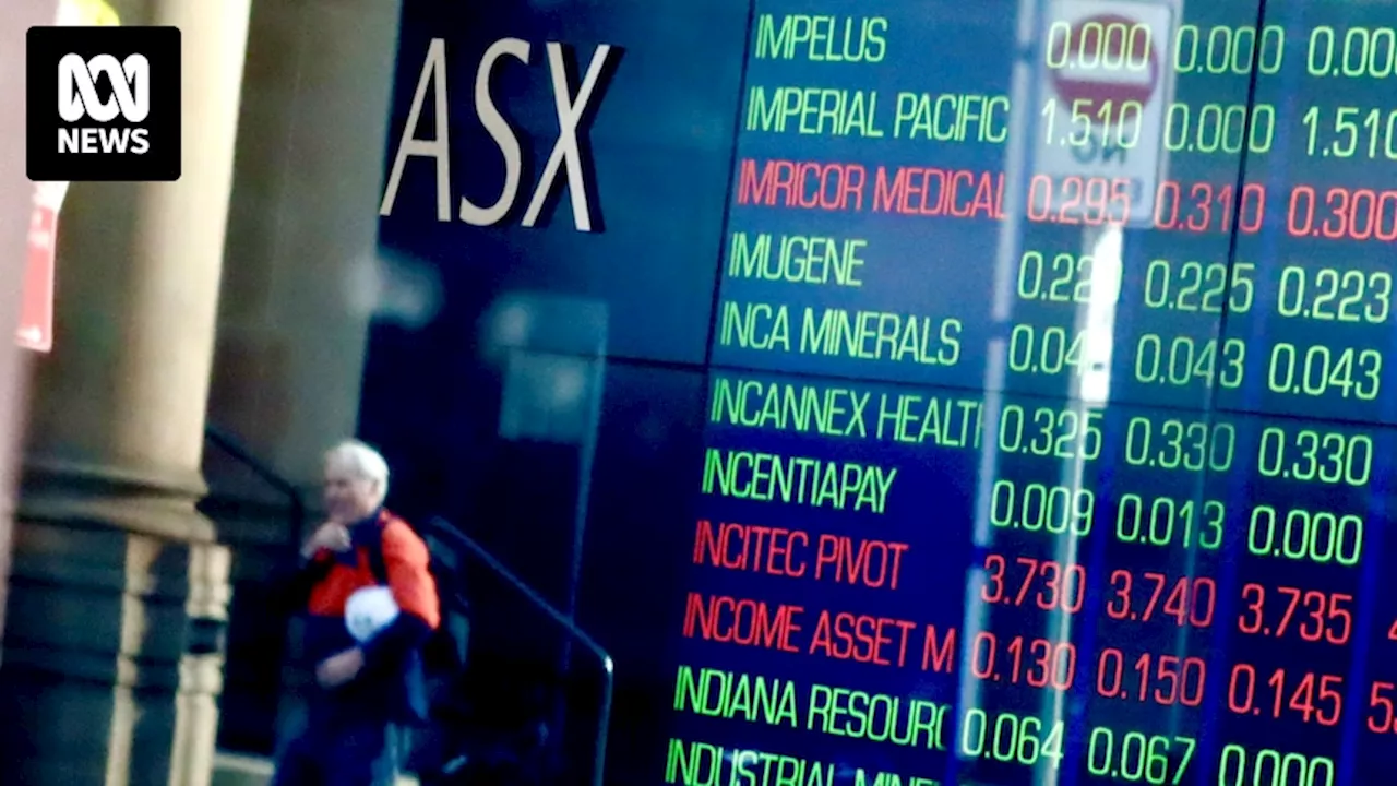 Live updates: Banks and energy drag ASX lower, despite Wall St's fresh records overnight