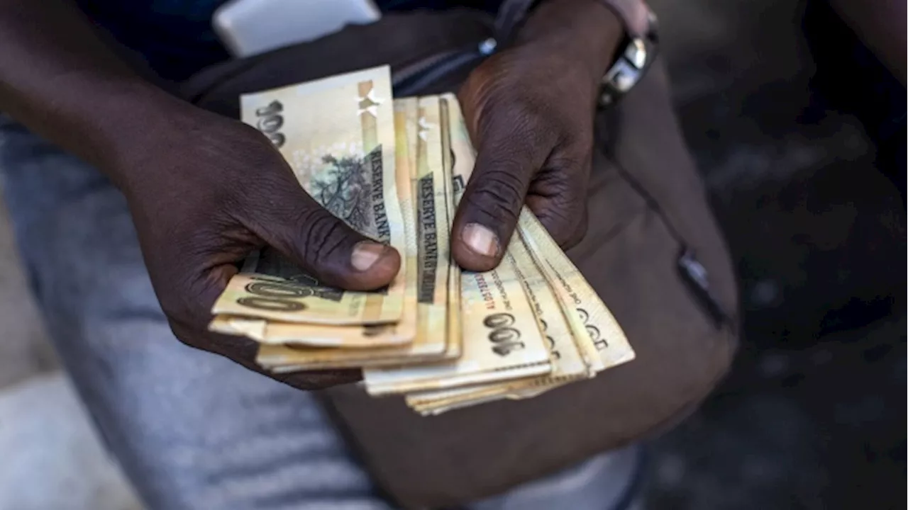 Battered Zimbabwe Currency Falls Past 20,000 Per Dollar in Official Trade