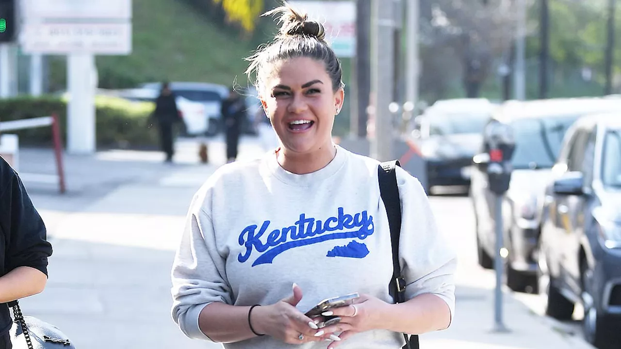 Brittany Cartwright and her estranged husband Jax Taylor wear their Wildcat colors as they arrive...