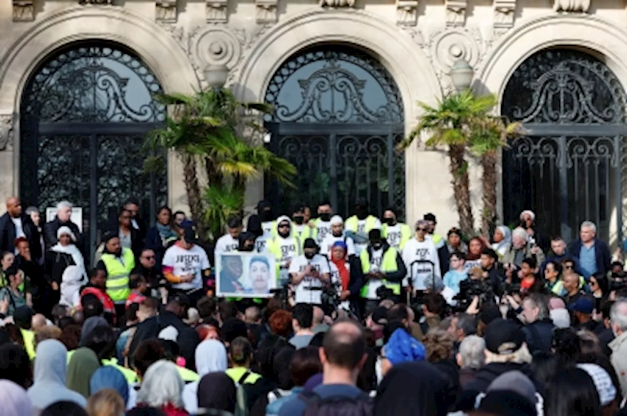 Hundreds march in Paris suburb after youth killed in police chase