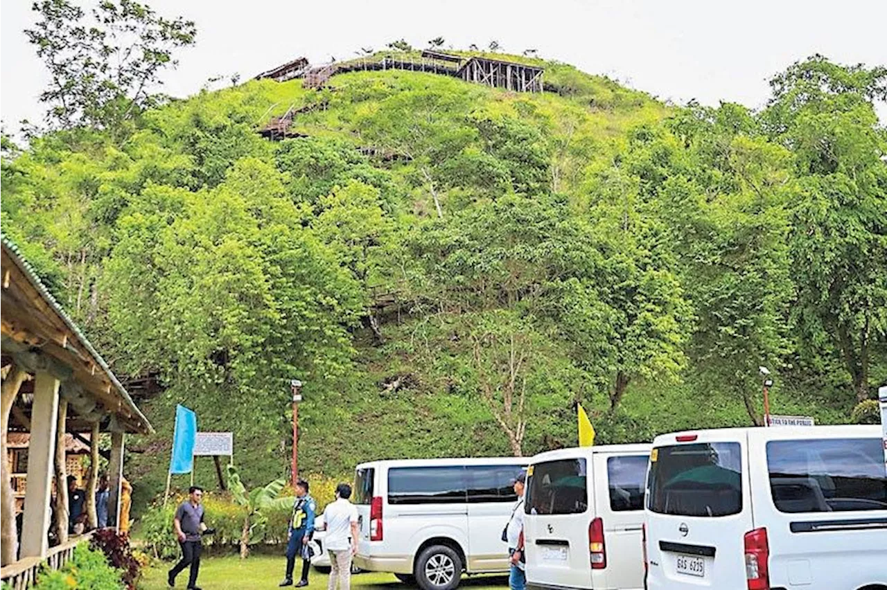 Some developers cut through Chocolate Hills