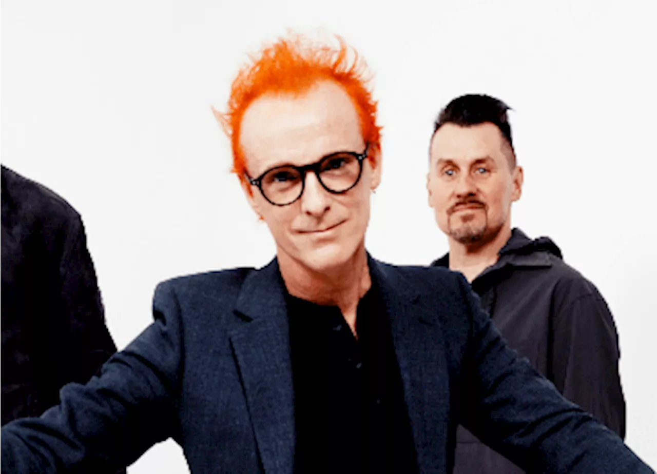 Iconic 90s group singer looks unrecognisable with bright ginger hair as band announce new album...