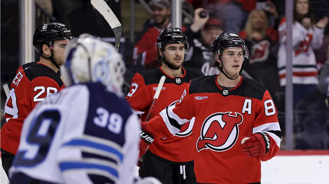 Hughes scores two as Devils stun Jets
