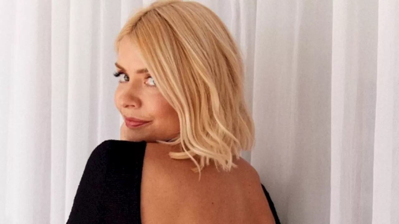 Holly Willoughby cuts a glamorous figure in black backless dress as she promotes Wylde Moon perfume