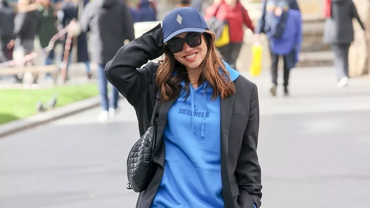 Myleene Klass opts for a stylish laid back look in a blue hoodie and cap as she heads to work at...