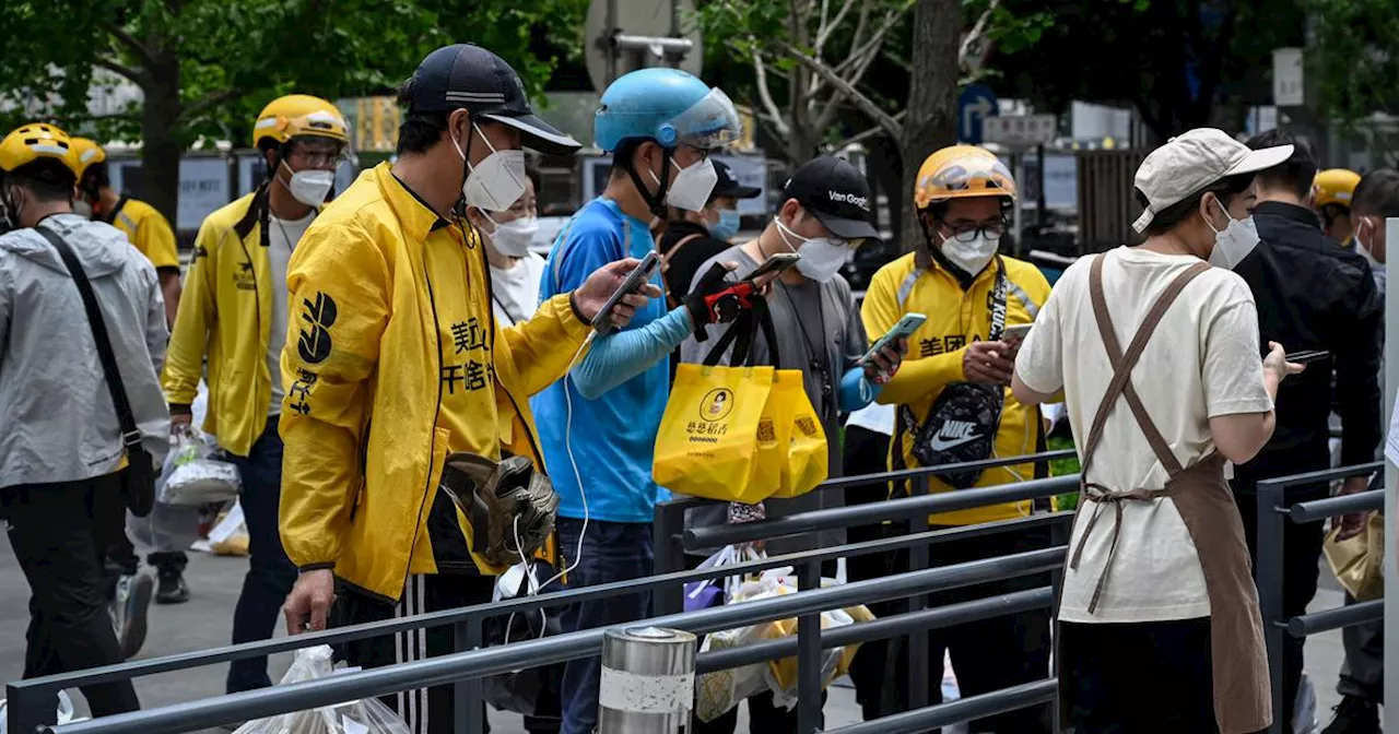 Biking Food Delivery Workers in Beijing Face Long Hours and Low Pay