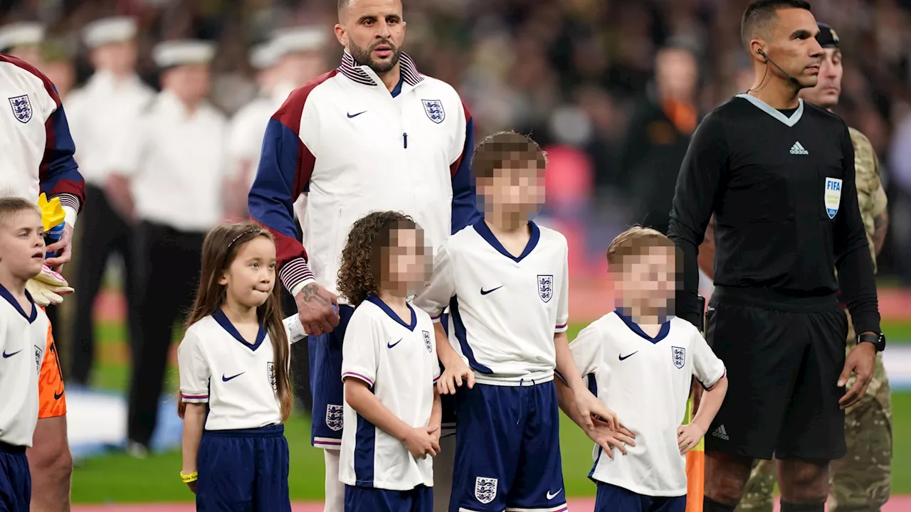 Kyle Walker shrugs off Lauryn Goodman drama as he leads England out with kids he shares with wife Annie by...