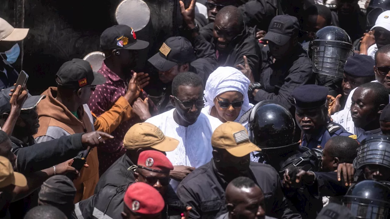 Senegal votes in a tightly contested presidential race after months of unrest