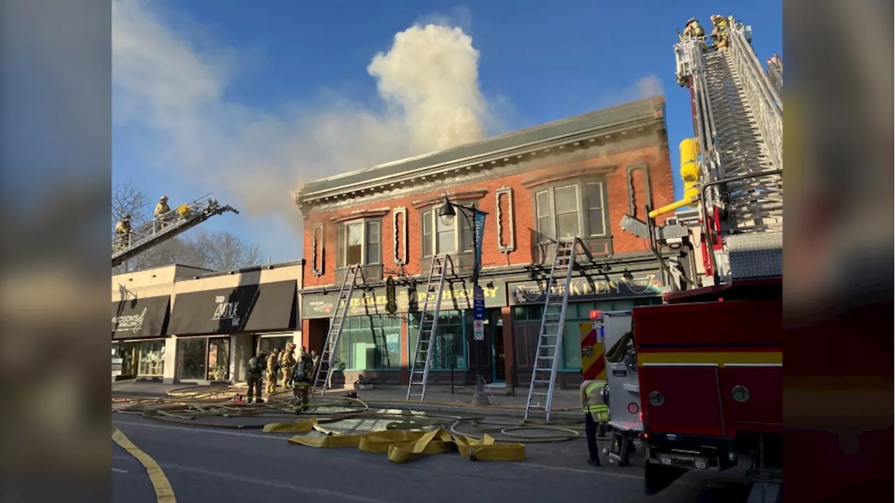 Firefighters battling fire along Bank Street in the Glebe