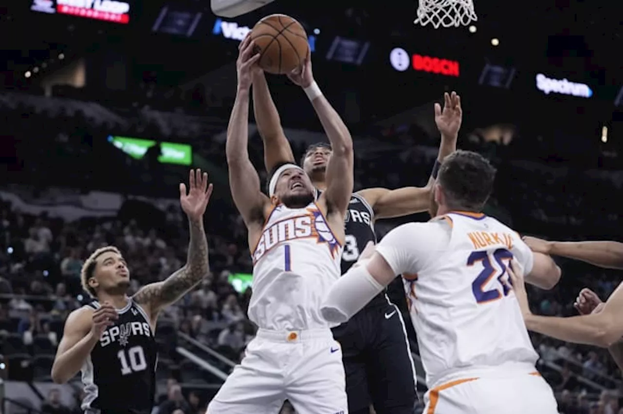 Booker scores 32 points and Suns never trail in steamrolling Spurs 131-106