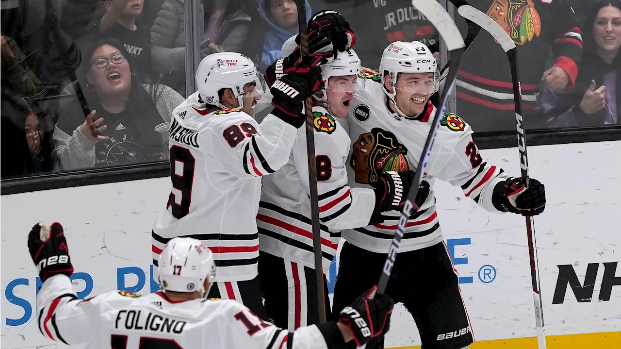 Jones scores twice, including OT winner as Blackhawks rally past Sharks