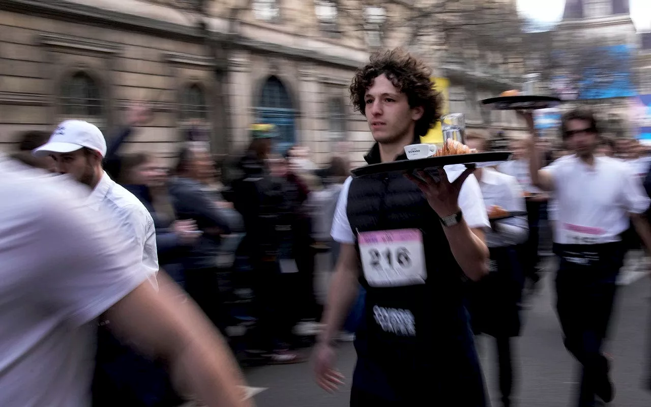 Paris waiters and waitresses dash to victory in revived 110-year-old racing tradition