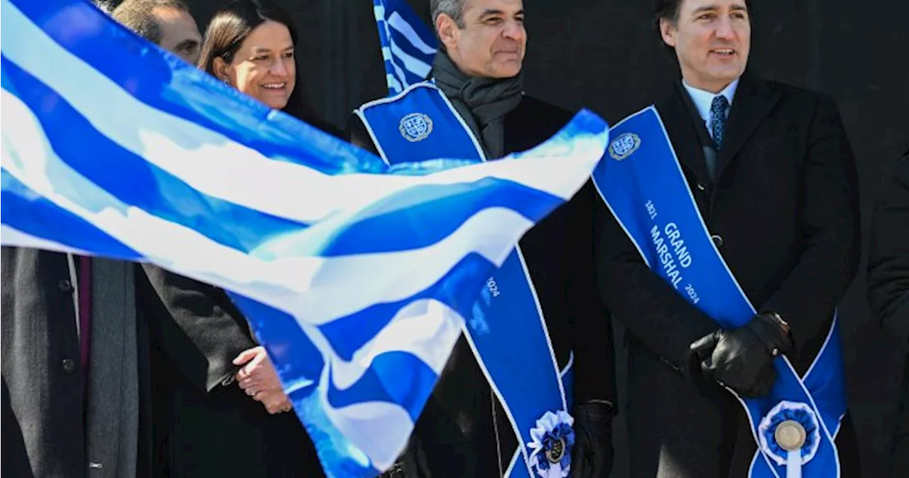 Justin Trudeau and Greek Prime Minister Mitsotakis walk in Montreal independence parade