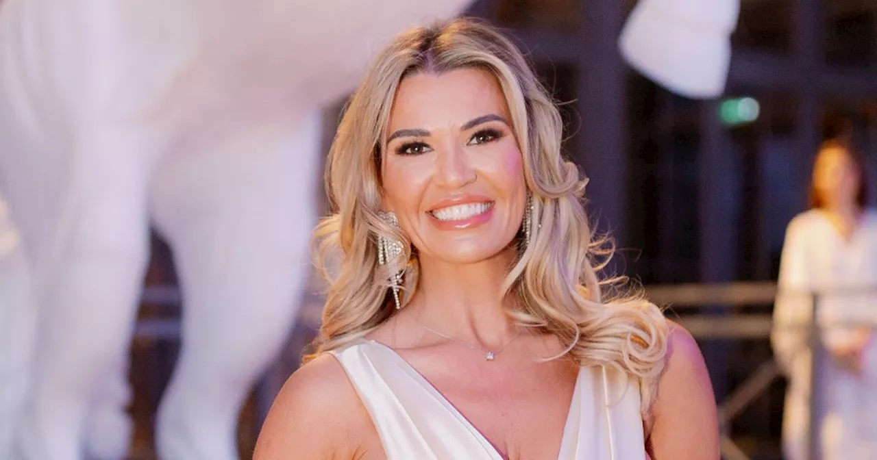 Christine McGuinness stuns in white gown as stars raise £1.2 million for charity