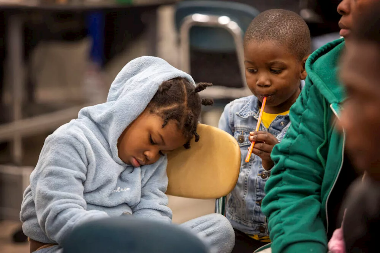 'Beyond terrible': With overflow shelters full, families huddle in cars and at Logan