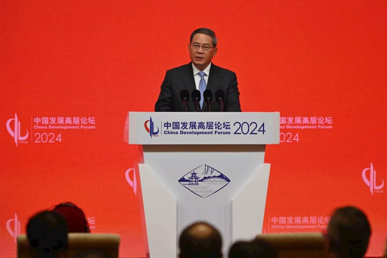 Chinese Premier Downplays Economic Risks as IMF Urges Reform