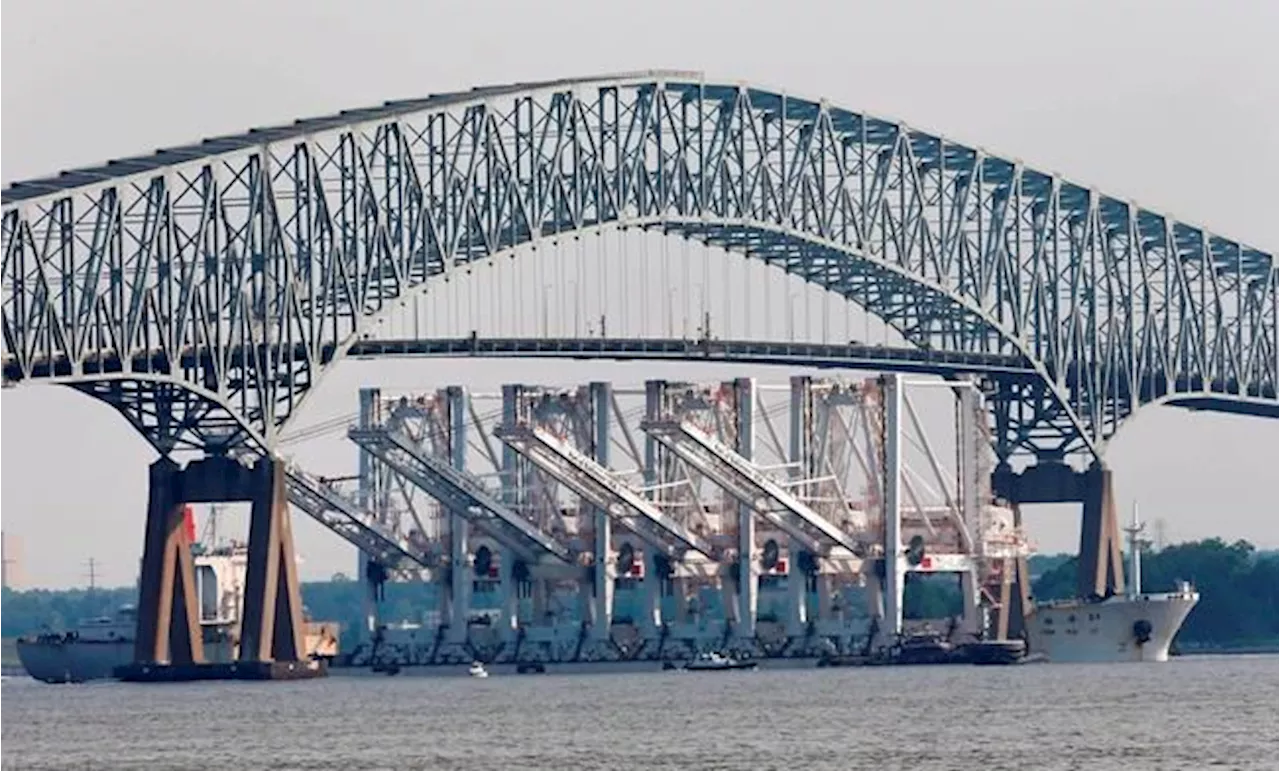 Cargo ship hits Baltimore's Key Bridge, causing it to collapse. Rescuers search for 7 in water