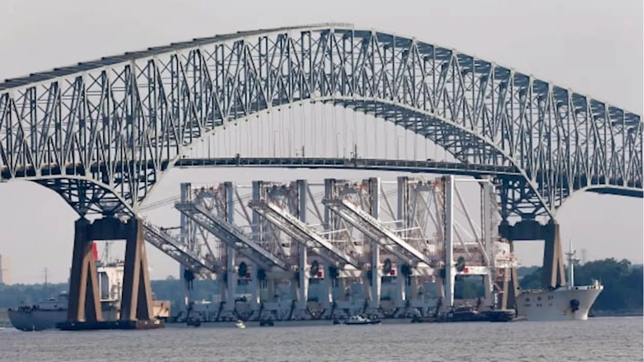 Baltimore bridge collapses after ship strikes it, sending vehicles into water