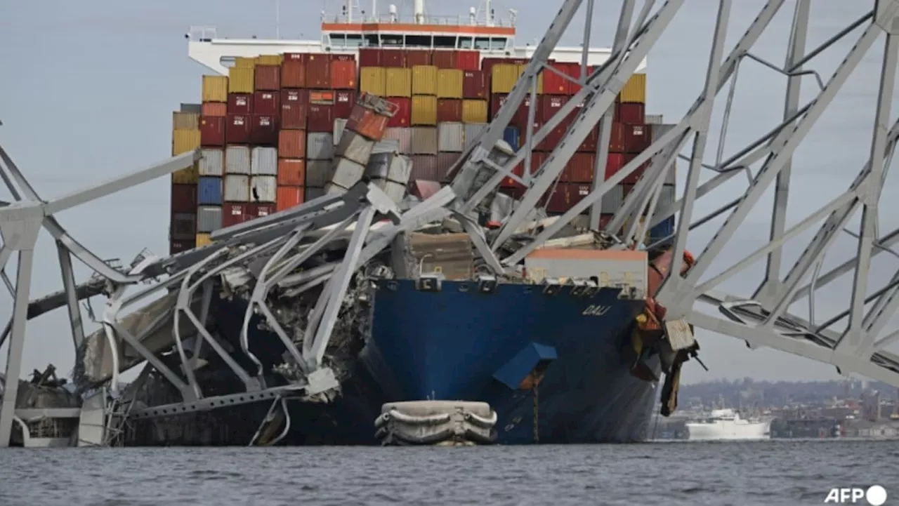 Baltimore bridge collapses after ship collision, six of eight people missing