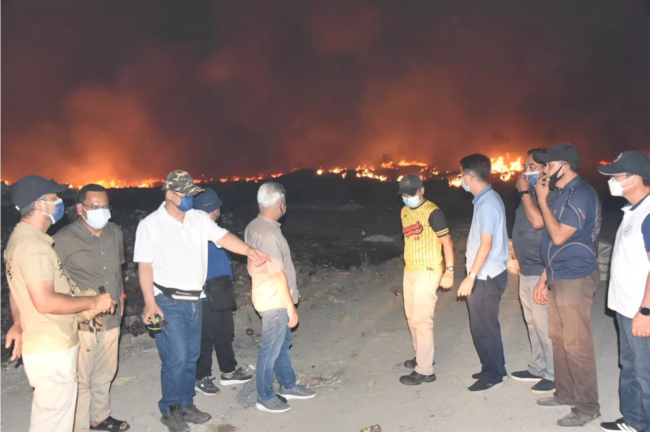 Kayu Madang landill fire caused by forest fire