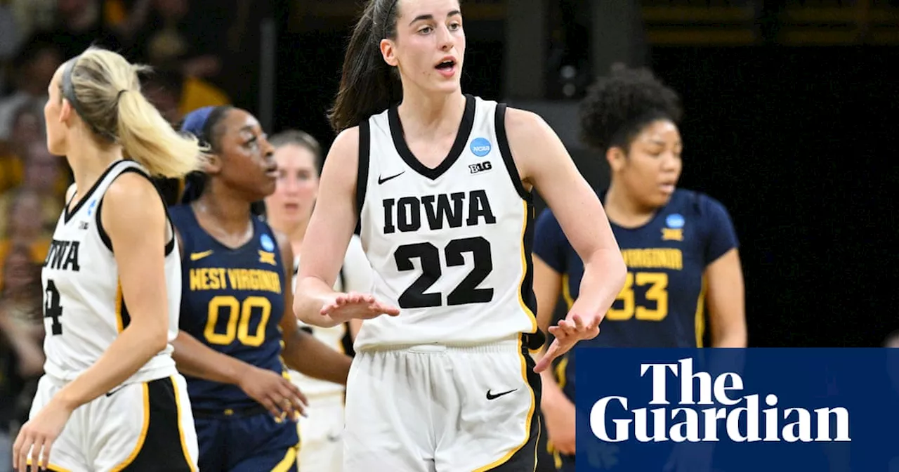 Caitlin Clark breaks single-season scoring record as Iowa survive scare