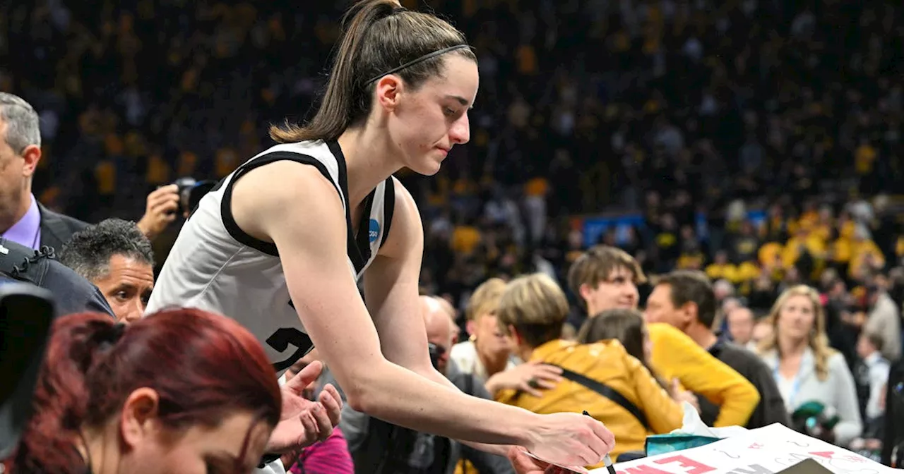 Caitlin Clark sets scoring mark as No. 1 Iowa survives vs. WVU