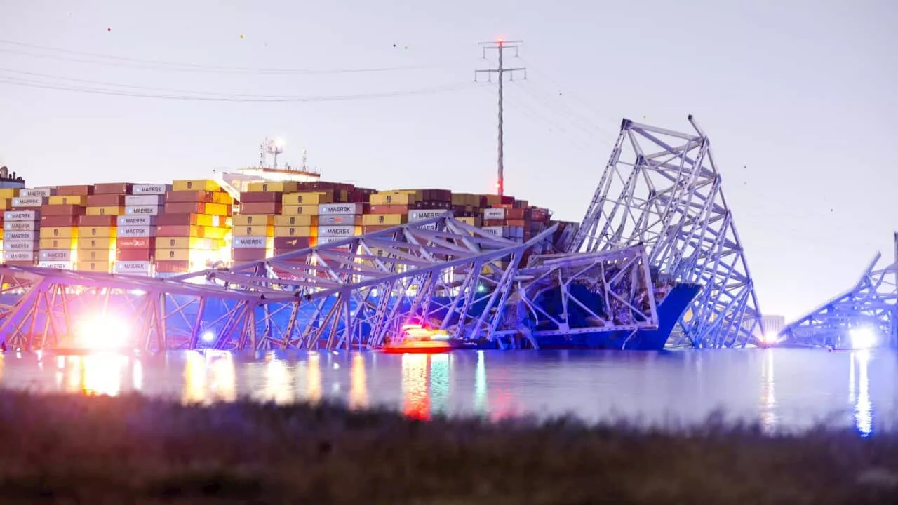 Baltimore bridge collapse: Rescue teams search water after container ship strike