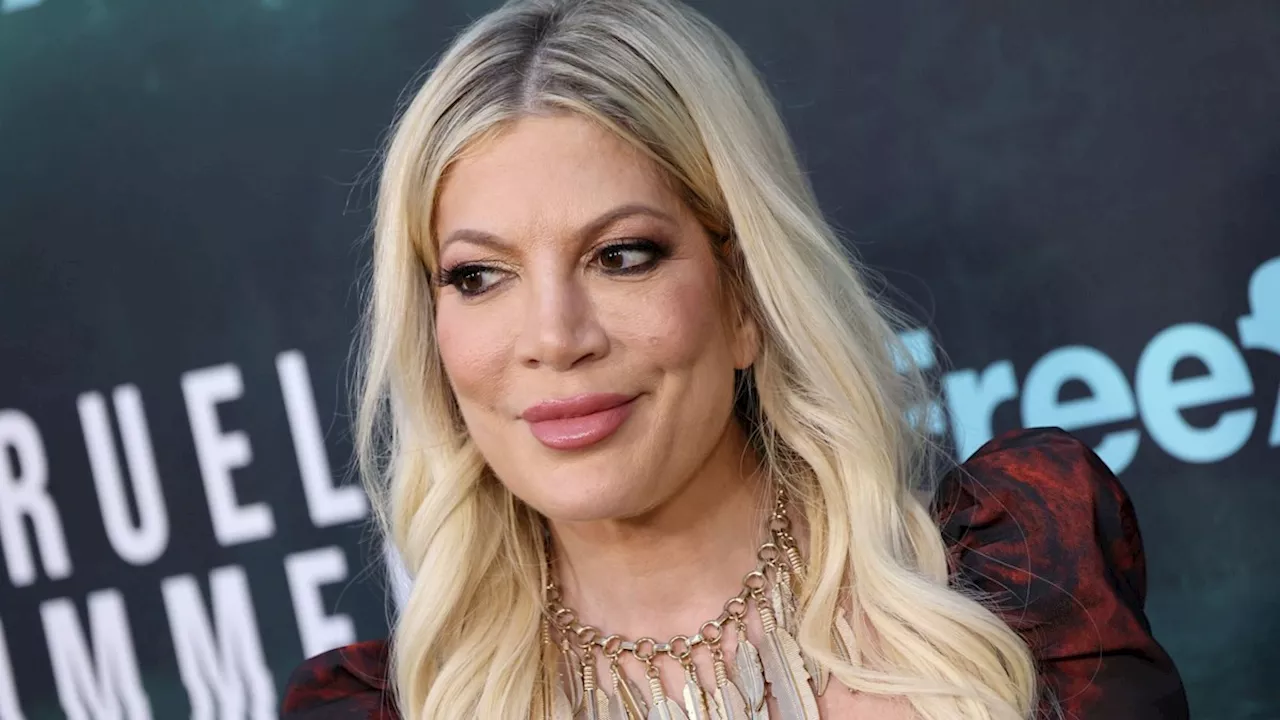 Tori Spelling, 50, effortlessly channels Y2K vibes in flared jeans and crop top