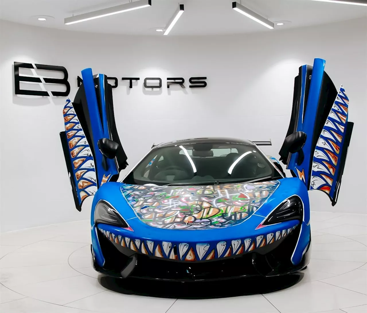 Exotic cars in the spotlight as luxury showroom gets turned into art gallery