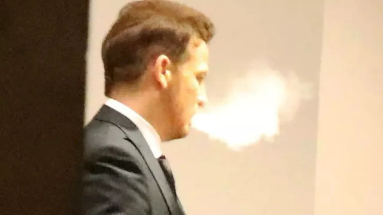 Secret vaper Joe Swash puffs away as he leaves posh awards ceremony with wife Stacey Solomon...