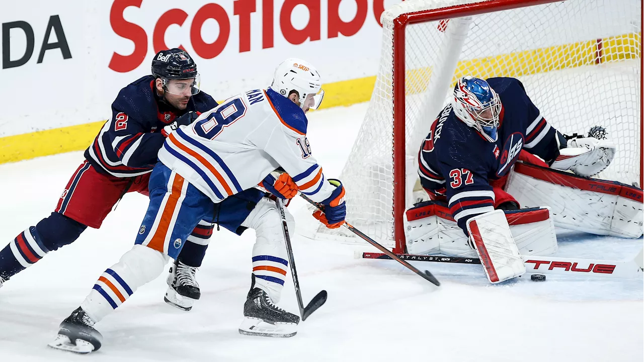 Hyman plays OT hero as Oilers edge Jets