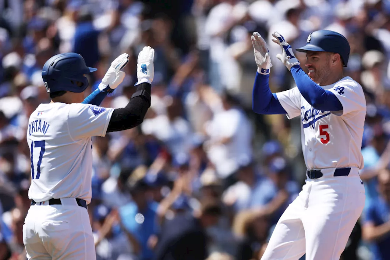 Shohei Ohtani reaches 3 times in home debut as the Dodgers rout the Cardinals 7-1