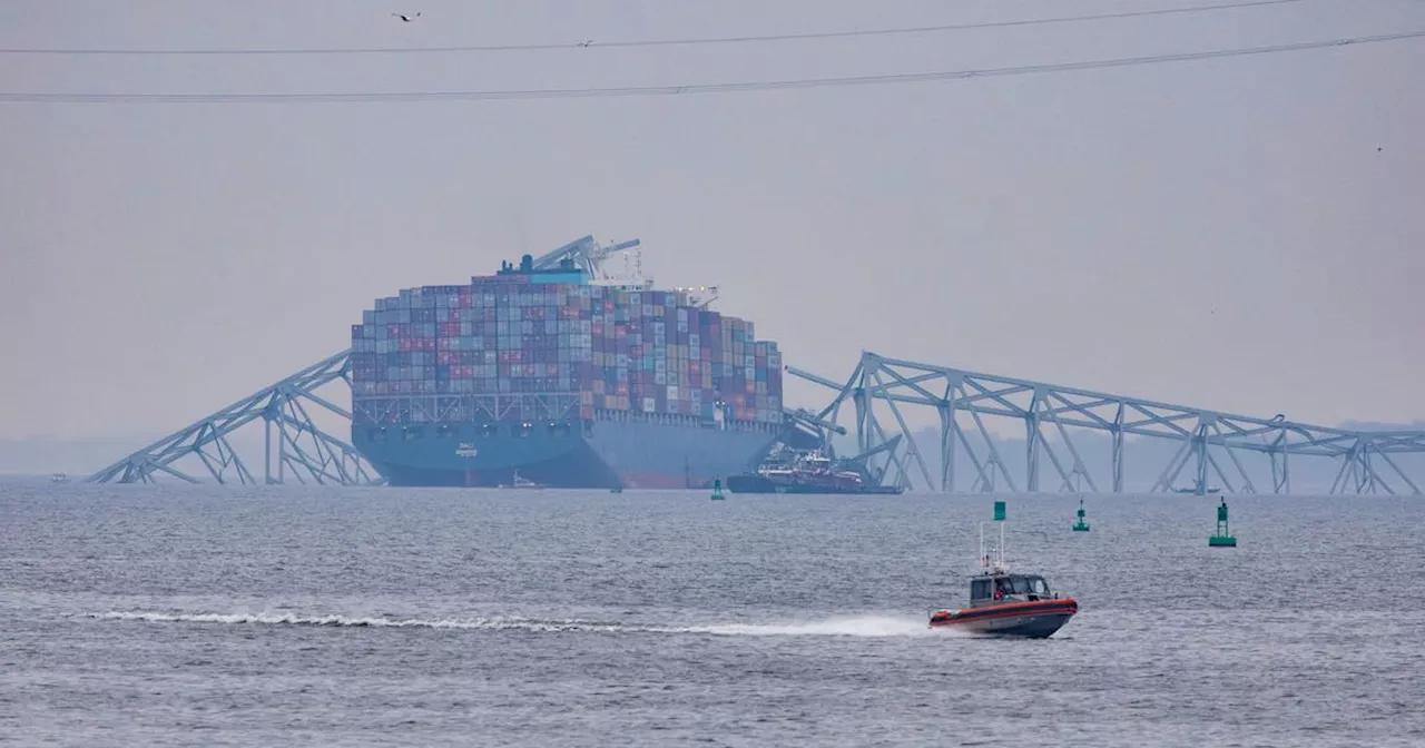 Massive crane put in place to clear Baltimore bridge debris as crews assess damage